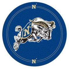 the u s naval academy logo on a blue circle with gold and white letters that read n