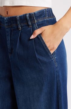 Make a statement in these pleated, vintage-inspired jeans fashioned with trouser-style pockets and superwide legs that sway with every step. 32" inseam; 30" leg opening; 11 1/2" front rise; 15 1/2" back rise Zip fly with button closure Side slant pockets 63% cotton, 27% polyester, 8% rayon, 2% spandex Machine wash, tumble dry Imported Super Wide Leg Jeans, Trouser Style, Maternity Shops, Pointed Toe Shoes, Designer Clothes For Men, Modern Outfits, Women's Summer Fashion, Athletic Women, Wide Leg Jeans