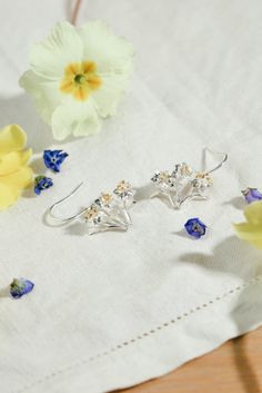 These bouquet of daffodils earrings are delicately detailed and made in solid silver with gold plated stamen. The Daffodil heralds the beginning of Spring and is also the symbol of Wales. These earrings would make the perfect gift for a bridesmaid or flower girl or for any gardener. The Daffodil is also the birth flower for March and would be a beautiful gift for a Mother on Mother's Day. - Available in solid 925 Sterling Silver with 22ct gold plated stamen - Handmade with love in our workshop i Miniature Daffodils, Bouquet Of Daffodils, Daffodil Flowers, Beginning Of Spring, Greeting Card Collection, Daffodil Flower, Country Gardens, Hand Necklace, Insect Jewelry