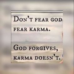 a sign that says don't fear god, fear karma go forgives, karma doesn't