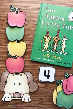 the ten apples up on top by dr seuss is displayed next to a book