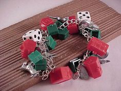 a close up of a bracelet with dices on it