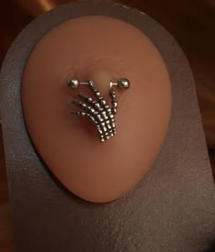 a pair of nails sitting on top of a table