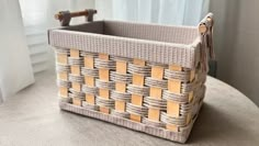 a woven basket sitting on top of a table