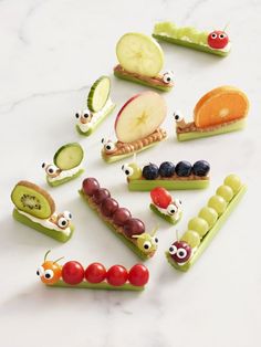 an advertisement for garden party with fruit and vegetables in the shape of caterpillars