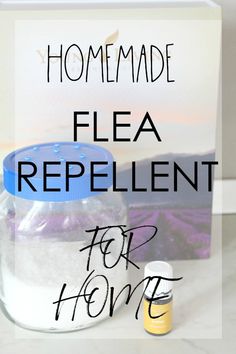 a glass jar filled with white powder next to a sign that says homemade flea repellent for home