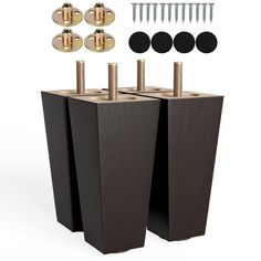 two black square pedestals with screws and studs on each side, all in different sizes