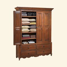 an armoire with drawers and linens on it's doors is shown in this image