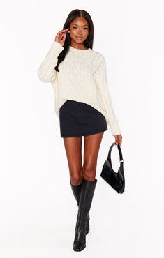 A closet staple you will be wearing on repeat! This classic cream cable knit is just what you need to build your year round wardrobe. Finish out warm days with your fave denim shorts, a layer over collared shirts and under jackets when the temperatures drop. Chic Cable Knit Sweater For Day Out, Bell Bottoms And Sweater, Sweater With Skirt, White Bachelorette Party Outfit, Kimono Crop Top, Maternity Dress Outfits, Dresses With Cowboy Boots, Nyc Fits, Round Wardrobe