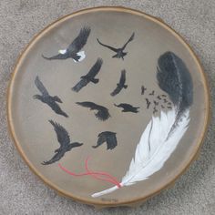 a plate with some birds painted on it