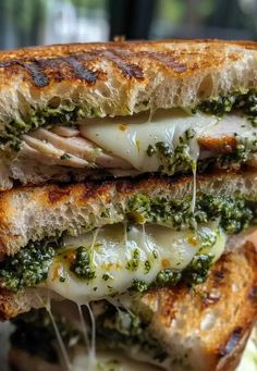 a grilled cheese and pesto sandwich on toasted bread