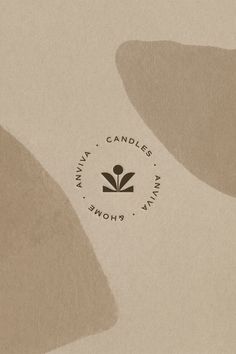 the logo for candles is shown in brown and beige colors, with an abstract design