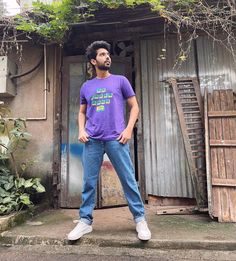 a man standing in front of a building