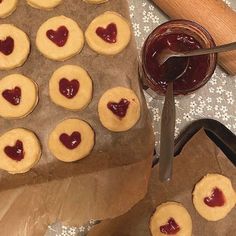 cookies with hearts on them and jam in the middle, ready to be cut into pieces