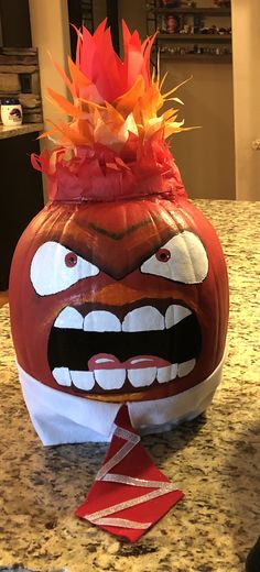 a large pumpkin with a face painted on it