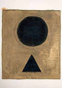 an abstract painting with a black circle and blue triangle in the center on a white wall