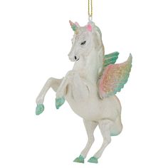 a white christmas ornament with a pink and green unicorn on it's back