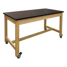 a wooden table with black top and casteors on wheels, against a white background