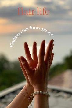 two hands reaching up to the sky with text overlay that reads, finding your inner peace