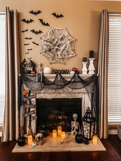 a living room decorated for halloween with candles and decorations