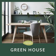 a table with chairs and a clock on the wall above it that reads trend green house