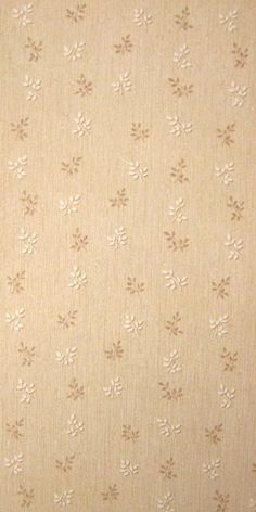 the wallpaper is beige and has small white flowers on it