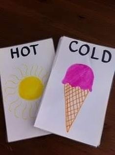 two children's handmade cards with the words hot and cold written on them