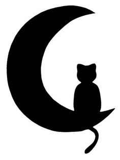 a black and white cat sitting on top of a crescent with the moon in the background