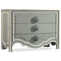 an old dresser with three drawers and knobs on the front, painted in gray