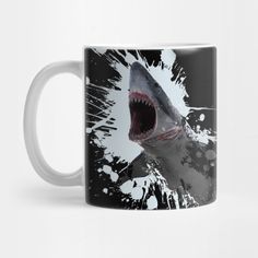 a shark with it's mouth open in front of the camera on a black and white coffee mug