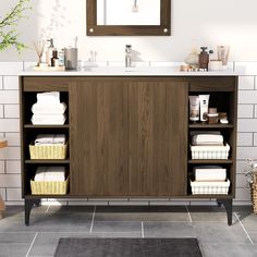 a bathroom with a sink, mirror and shelving unit in the middle of it