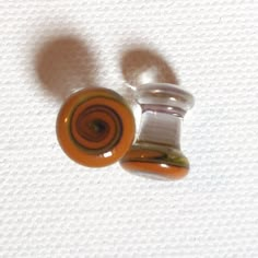 This set of glass plugs were made for someone with 2 gauge piercings. They are one of a kind and unique in shape, made by me. This set is fared on each end, one a bit less than the other for easier inserting. I like this style because they are the most comfortable when sleeping and they don't fall out. All plugs have been hardened, or annealed in a kiln to strengthen the glass to ensure durability, as well as bring out the unique coloring of the glass. Glass is a hypoallergenic material, and gre Glass Ear Plugs, Gauge Piercing, Red Spiral, Plug Earrings, Plugs Earrings, Gauges Plugs, Ear Plugs, Piercing Tattoo, Body Mods