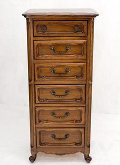 an old wooden dresser with many drawers