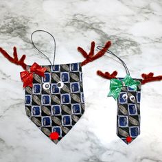 two christmas decorations made to look like reindeer heads