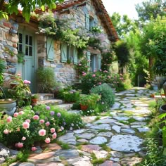 a cobblestone path leads to a stone cottage