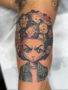 a man's arm with a cartoon character on it and many other characters around him