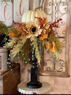 a vase filled with flowers sitting on top of a table