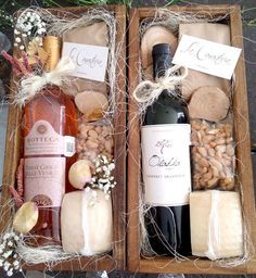 two wooden boxes filled with different types of wine and cheeses next to each other