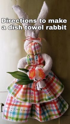 a stuffed rabbit in a dress with the words directions to make a dish towel rabbit