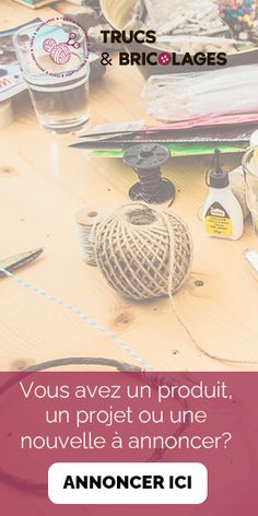 a wooden table topped with lots of crafting supplies