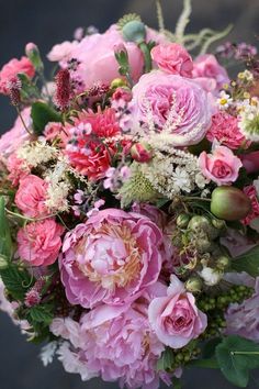 a bouquet of pink flowers and greenery