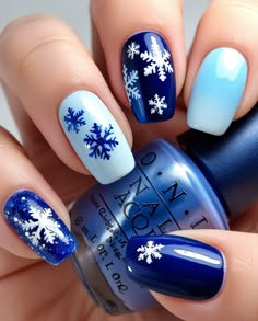 December Nails Blue are the perfect way to capture the essence of winter. From icy blues to bold navy, these cool shades will give you a fresh, frosty look that's perfect for any December occasion. #DecemberNailsBlue #BlueNails #WinterNails #HolidayNailArt #DecemberNails Short Blue And Silver Nails, Christmas Nails Blue Short, Silver And Blue Christmas Nails, Blue Snowflakes Nails, Silver And Blue Nail Designs, Xmas Nails Blue, December Nails Designs, Navy Blue Christmas Nails, Blue New Years Nails