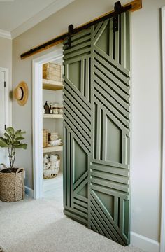 an open sliding door in the corner of a room with a basket on the floor