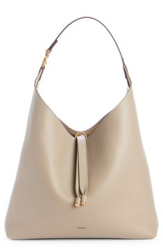 This slouchy calfskin-leather hobo bag blends a modern aesthetic with a '70s folk spirit, and of course has the Marcie line's signature slip-tassel closure. Tassel closure Shoulder strap Leather lining Leather Made in Italy Designer Handbags This brand has B Corp certification, representing business practices with emphasis on social and environmental performance, accountability and transparency This brand meets Nordstrom Responsible Brands criteria: brand adheres to responsible social and enviro Electronics Projects For Beginners, Slouchy Bag, Tory Burch Tote, Tory Burch Robinson, Hobo Bags, Favorite Daughter, Chloe Marcie, Leather Hobo Bag, Chloe Bag