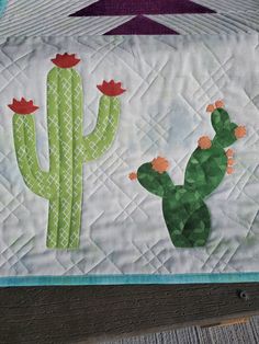 Southwest themed table runner. Make this stunning quilt block with cactus applique the center of your table decor. Finishes 16" x 42". Advanced beginner. Cactus Applique Pattern, Cactus Applique, Table Runner Quilt Pattern, Table Runner Quilt, Quilted Table Runners Patterns, Table Quilts, Baby Quilt Patterns, Quilt Border, Table Runner Pattern