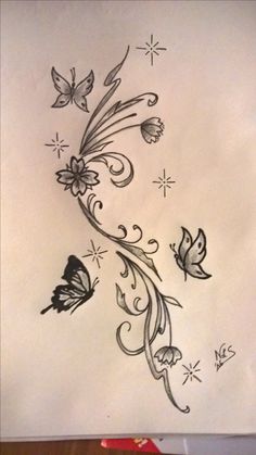 some flowers and butterflies are drawn on paper