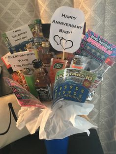 a gift basket filled with various items for someone's 50th anniversary party or baby shower