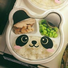 a panda bear plate with rice and peas