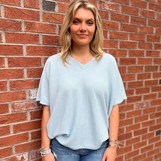 Introducing our chic and contemporary women's fashion top, where style meets comfort effortlessly. The cocoon sleeves add a modern twist, offering a relaxed yet flattering silhouette that drapes beautifully. Whether you're heading to a brunch date or a casual evening out, this versatile piece effortlessly transitions from day to night. Pair it with your favorite jeans for a laid-back vibe, or dress it up for a polished look. Fall Faves, Southern Women, Brunch Date, Casual Evening, Fashion Top, Oversized Tee, Short Rompers, Ladies Tops Fashion, Dress Romper