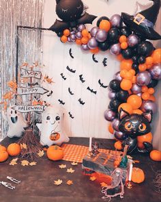 a halloween themed party with balloons and decorations